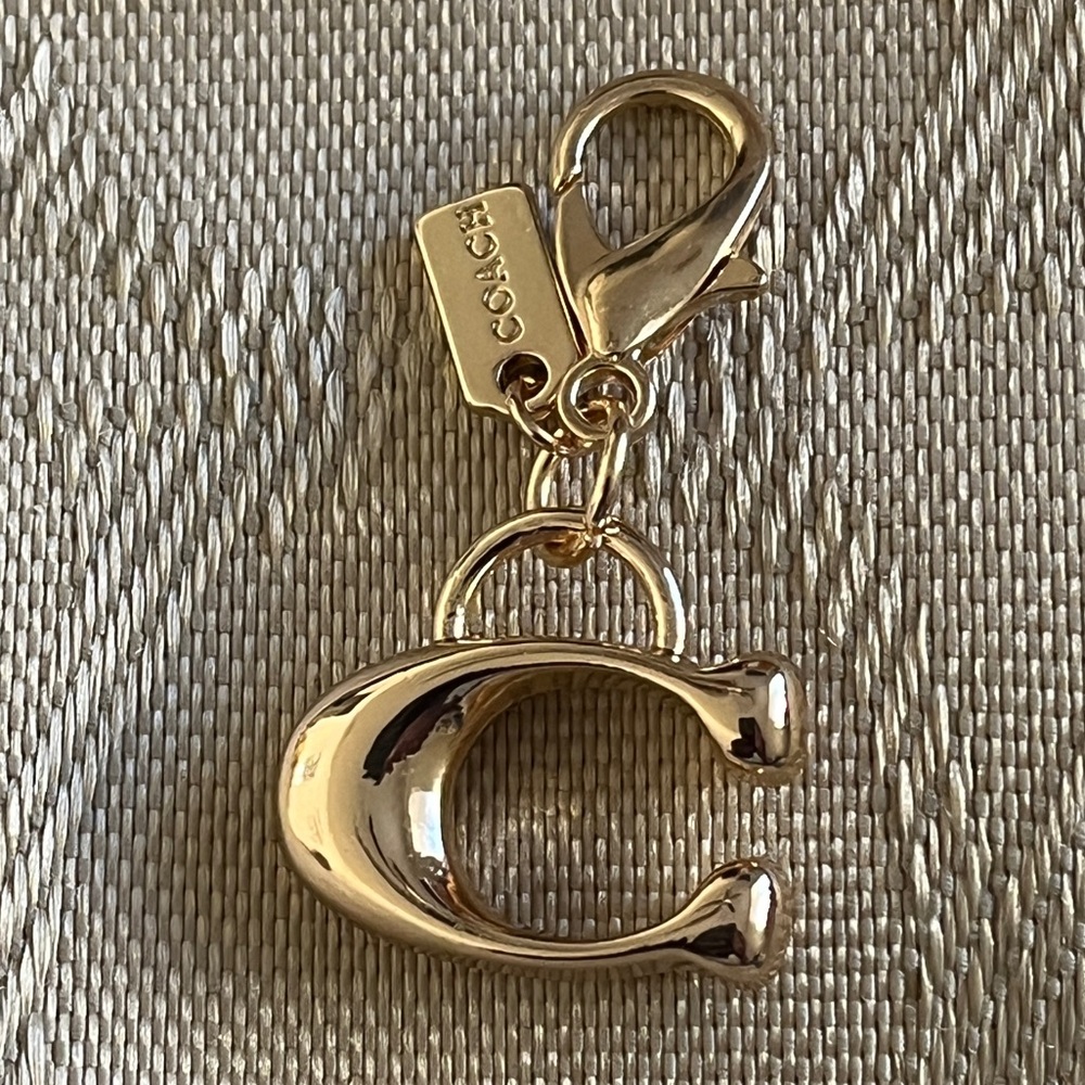 Gold Toned Signature C Zipper Pull Charm.